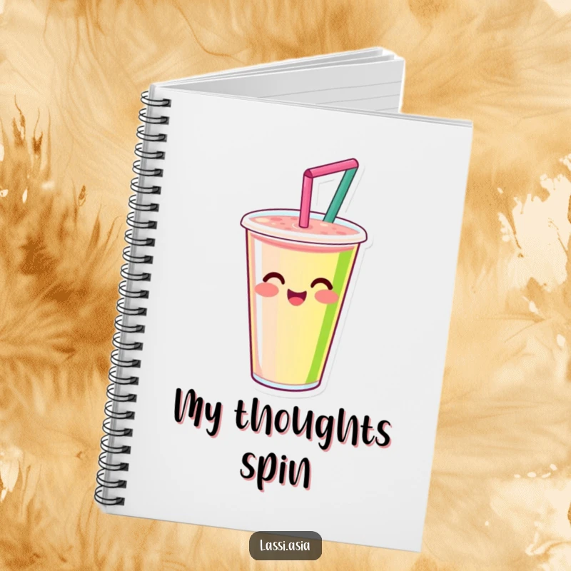 Funny smiling smoothie cup with straw, happily spinning with vibrant colors on a notebook, ready for ideas.